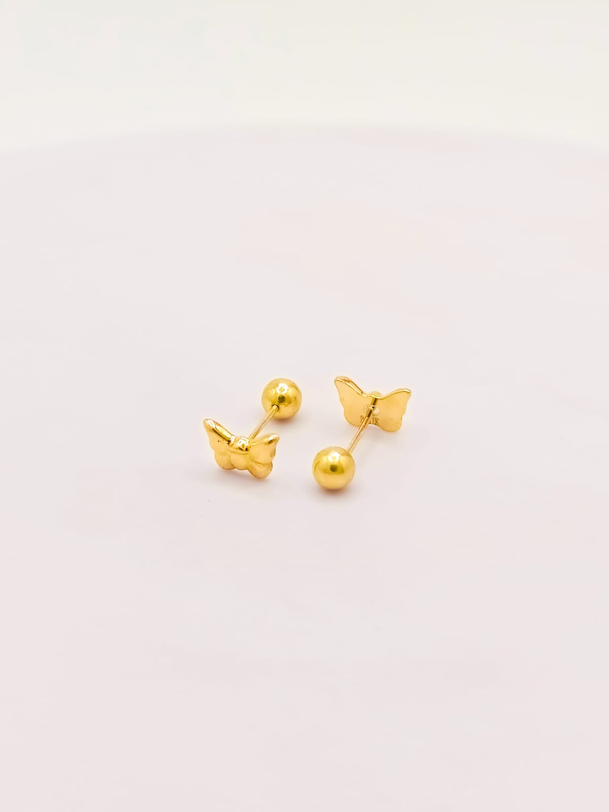 Aretes de oro 18k Mariposa reversibles bombeados
