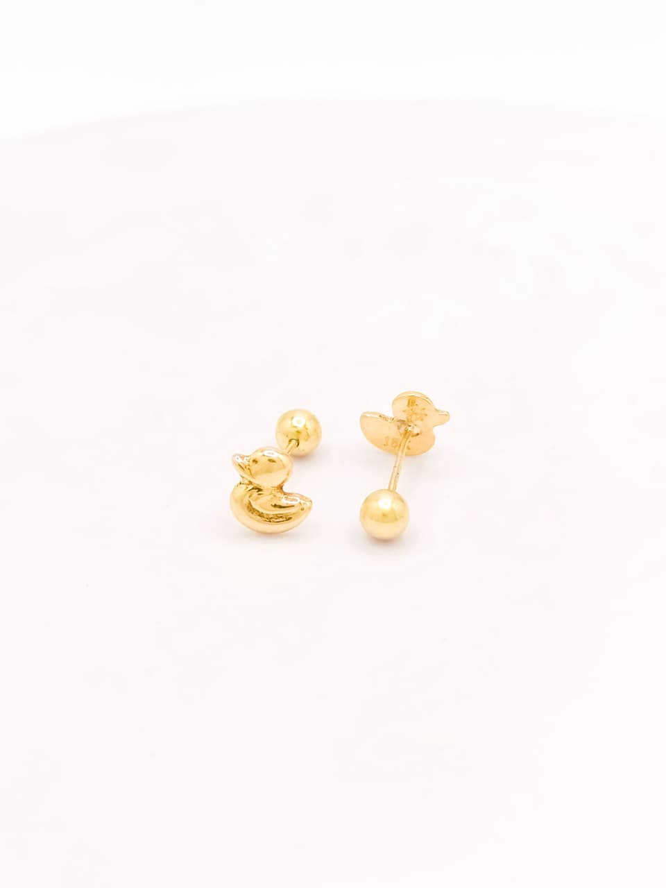 Aretes de oro 18k Pato reversibles bombeados